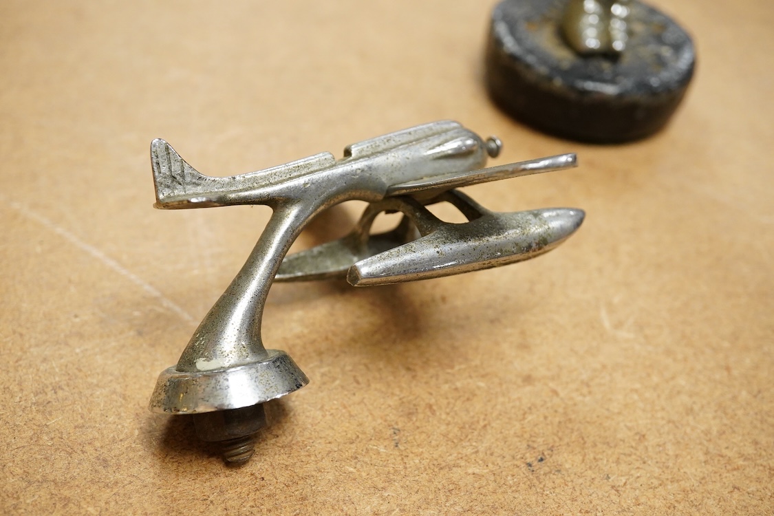 A chrome seaplane car mascot (lacking propellor) and a chrome imp car mascot- 14cm high